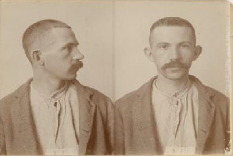 A mug shot of Reimund looking to the right side and then to the front.
